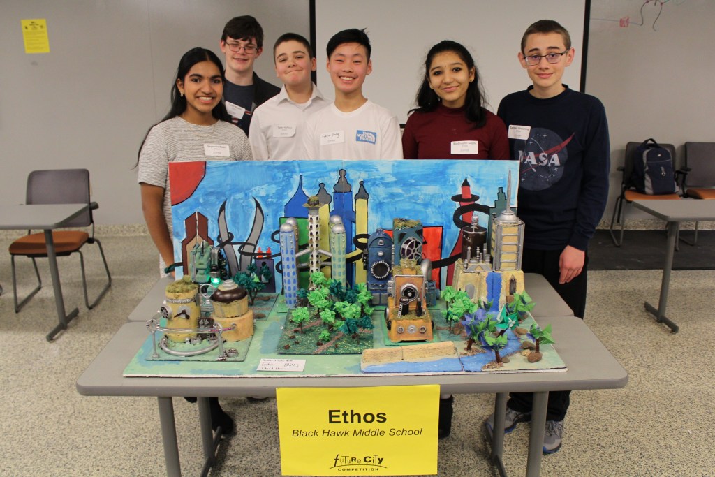 Black Hawk middle school students with future city model