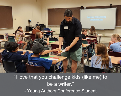 An author hands a paper to a student in a classroom while kids sit at their desks; the caption reads, "I love that you challenge kids like me to be a writer -Young Authors Conference Student"
