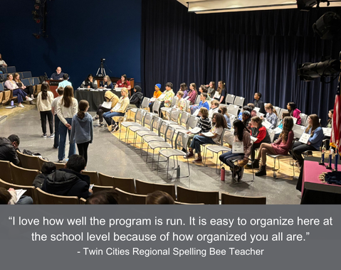 Students sit on stage at a spelling bee as teachers and judges stand nearby; quote about program organization shown.