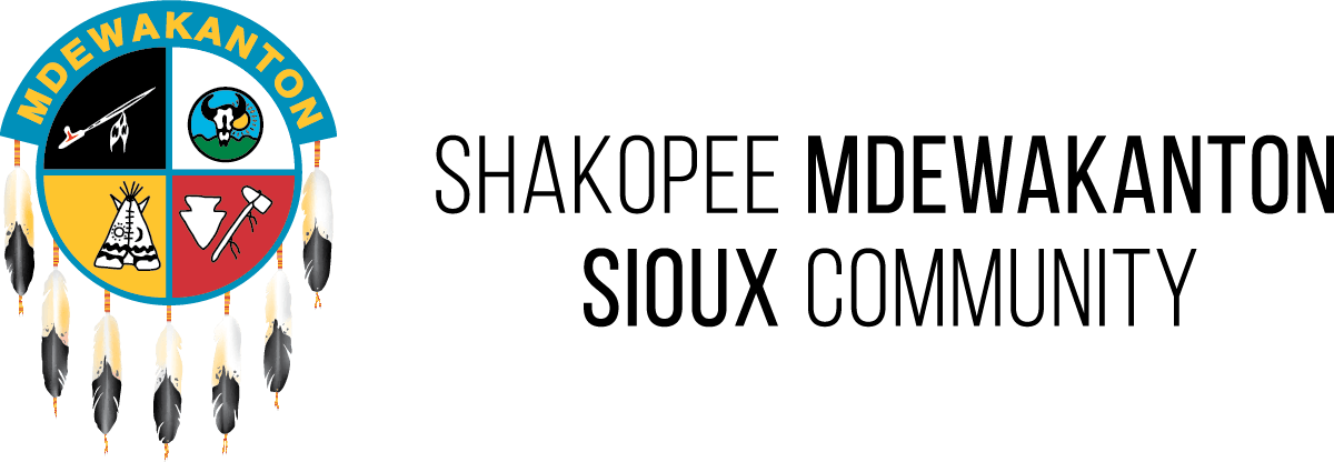 Shakopee Mdewakanton Sioux Community logo and name with feather and shield design.