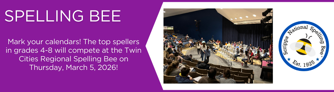 Students on stage compete in a spelling bee, with an audience watching in an auditorium.