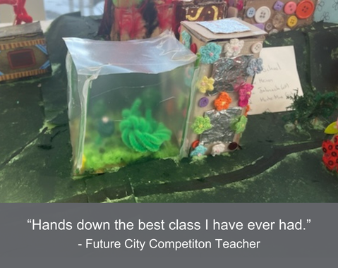 A colorful classroom model with a quote about a great class from a competition teacher.